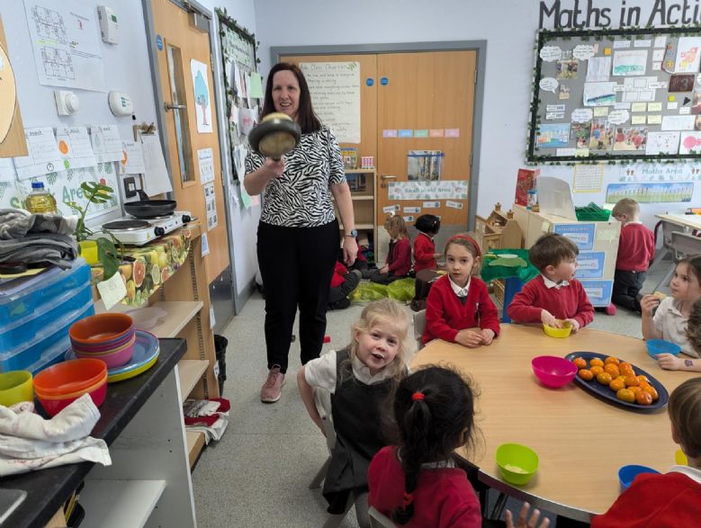 Teacher making pancakes