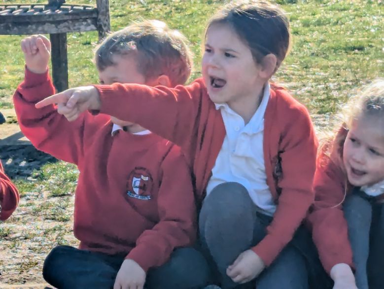 Girl pointing and cheering